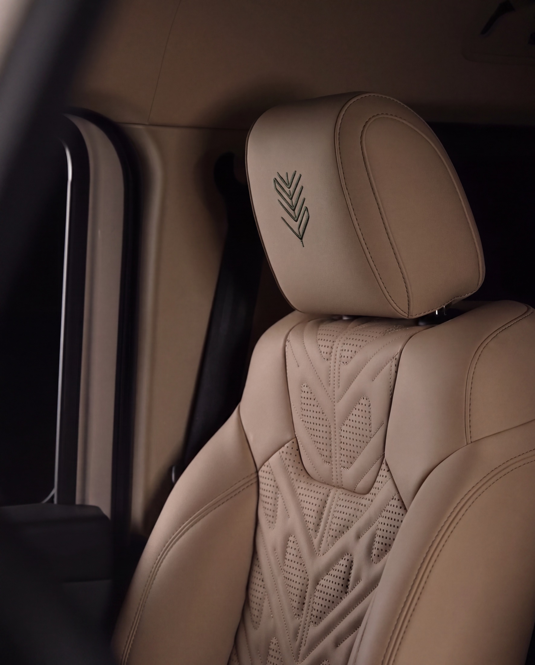 Ghaf motif embroidered into leather upholstery